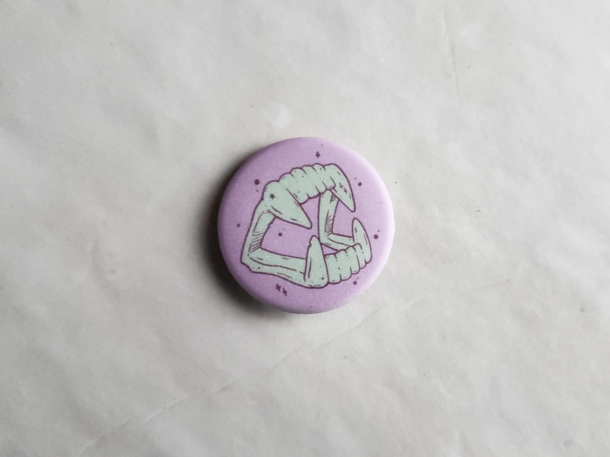 Green Vampire Fangs pin badge