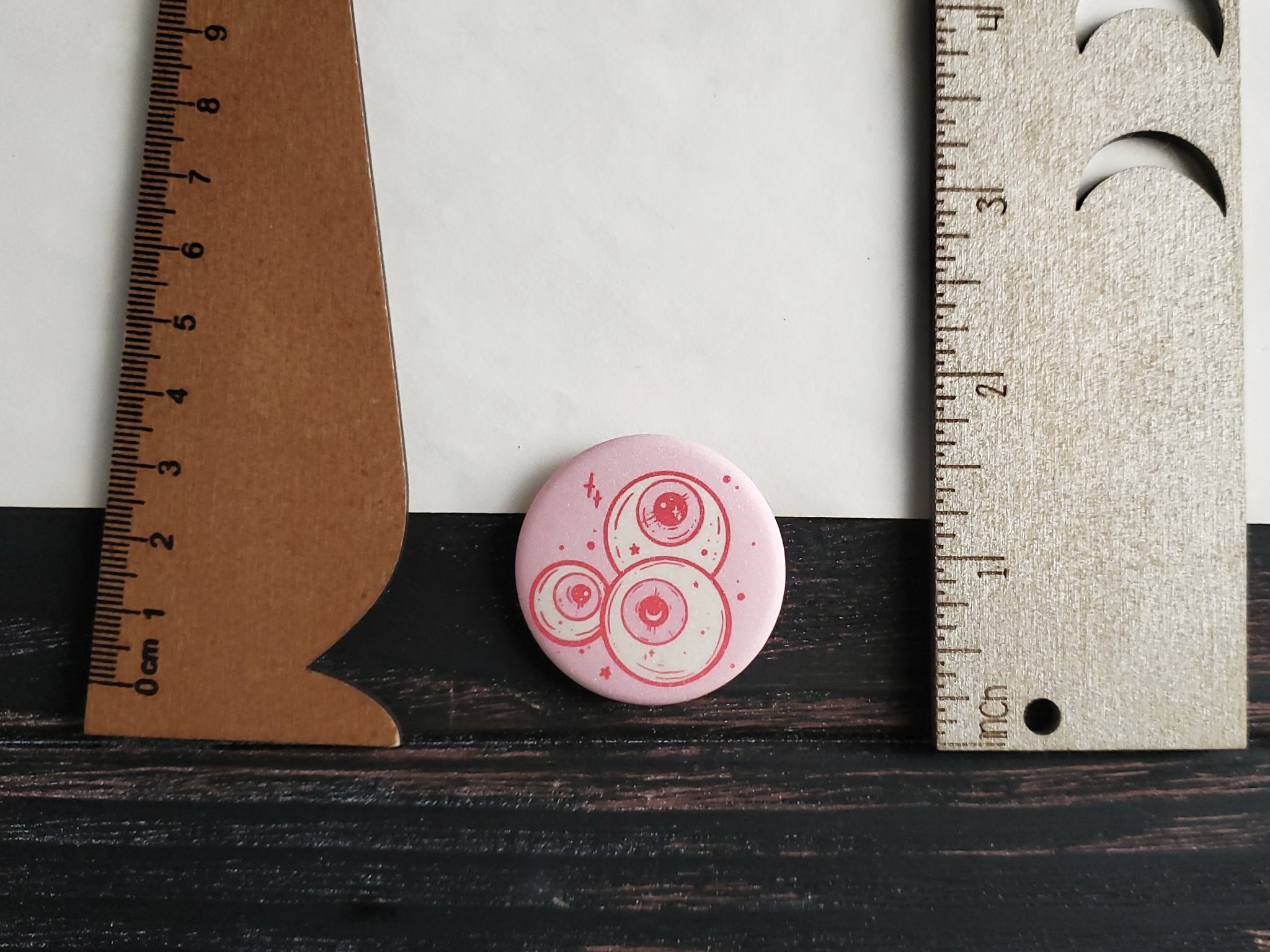 Pink Eyeballs pin badge